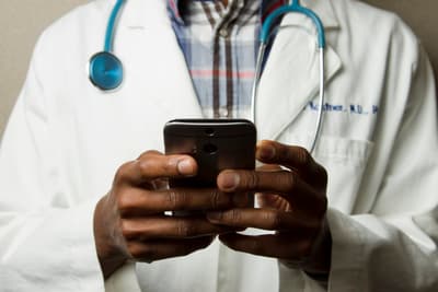 Healthcare professional reviewing practice finances in a modern medical office